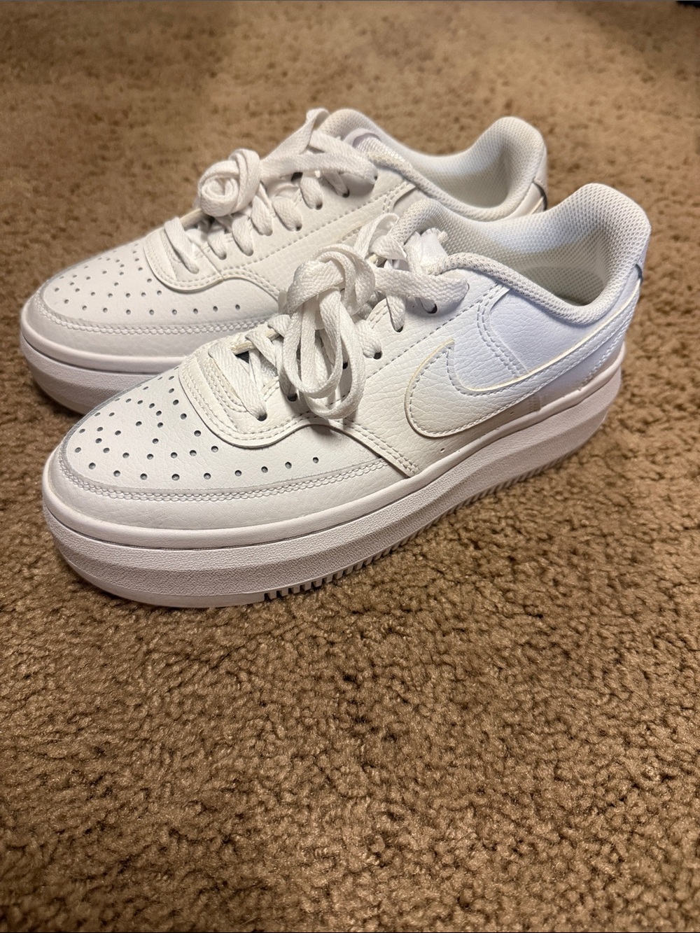 Nike women's All-White Platform Sneakers with iconic Swoosh